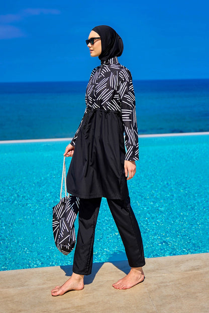 Black full coverage modest swimwear set for women, Marina Modest Tam Kapalı Mayo, with long sleeves and high neckline.
