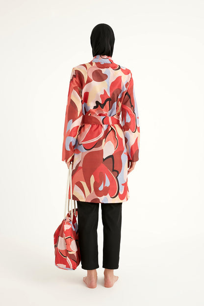 Black full coverage modest swimwear set for women by Marina Modest, featuring long sleeves and a high-neck design.