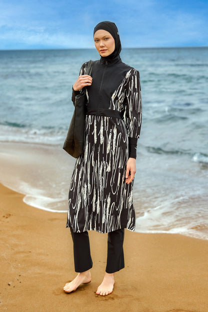 Black full coverage swimwear burkini set by Marina Modest, featuring modest design and full-body coverage for beach or pool.