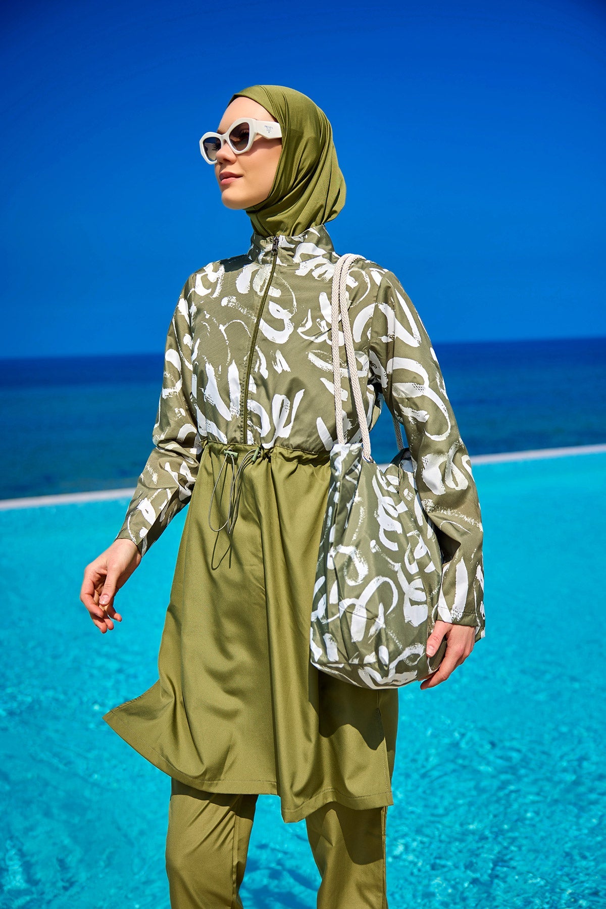 Green full coverage modest swimwear set for women by Marina Modest, featuring a tam kapalı mayo design for comfortable swimming.