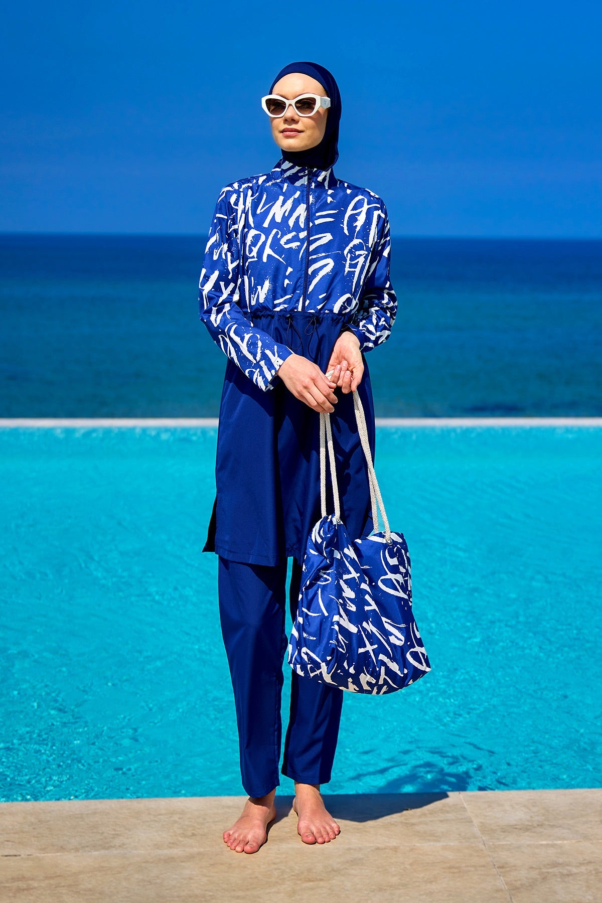 Navy blue full coverage modest swimwear set by Marina Modest, featuring a tam kapalı mayo design for full sun protection.