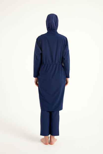 Navy full coverage modest swimwear burkini set by Marina Modest, featuring a long-sleeve top and matching full-coverage bottoms.