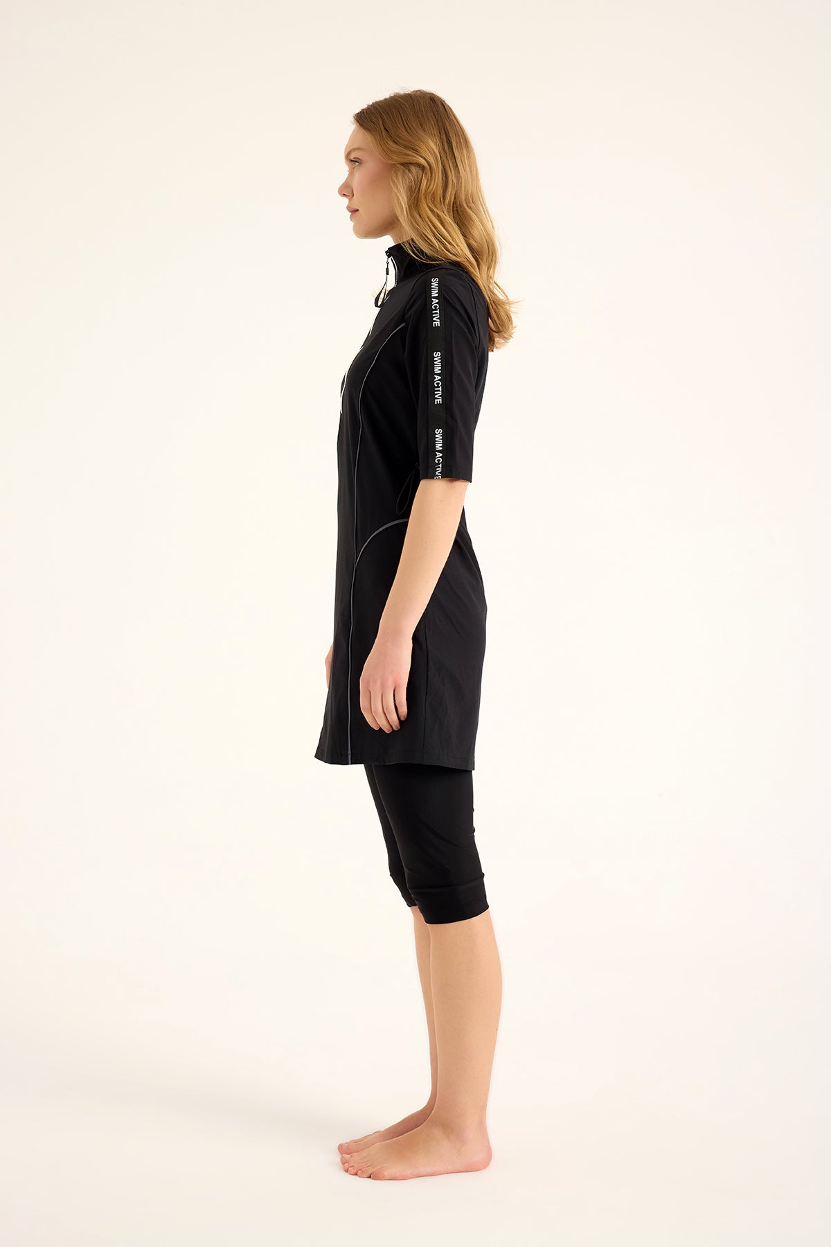 Marina Modest black half-coverage swimsuit for women, designed for modest swimming, featuring a stylish full-coverage design.