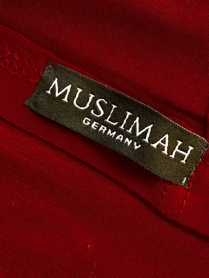 Maroon cotton jersey hijab from Muslimah.de draped on a display, showcasing soft fabric and elegant style.