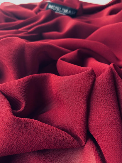 Maroon premium chiffon hijab by Muslimah.de displayed flat, showing its lightweight, flowing fabric and elegant drape.