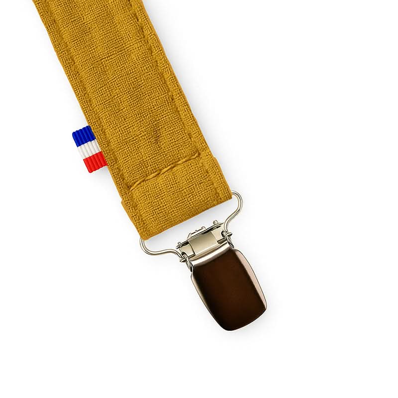 Natural cotton teething pacifier clip by PAPATE in honey color, designed to keep pacifiers secure and within baby's reach.