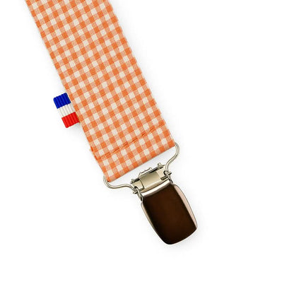Organic cotton Vichy bib for teething attachment by PAPATE, featuring soft fabric and secure clip for baby teething needs.
