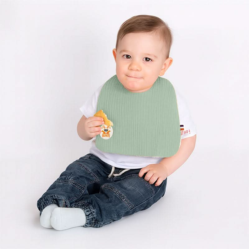 Green organic cotton bib by PAPATE, soft and absorbent baby bib with adjustable neck for feeding and teething.