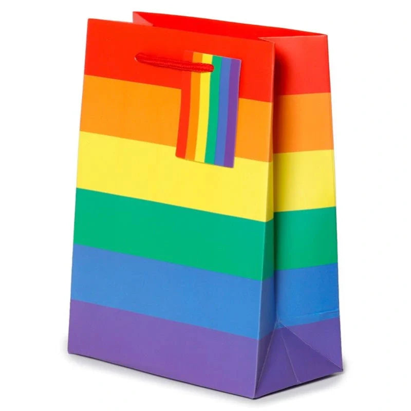 Medium rainbow gift bag from Proud Supplies with colorful rainbow design and sturdy handles for gift presentation.