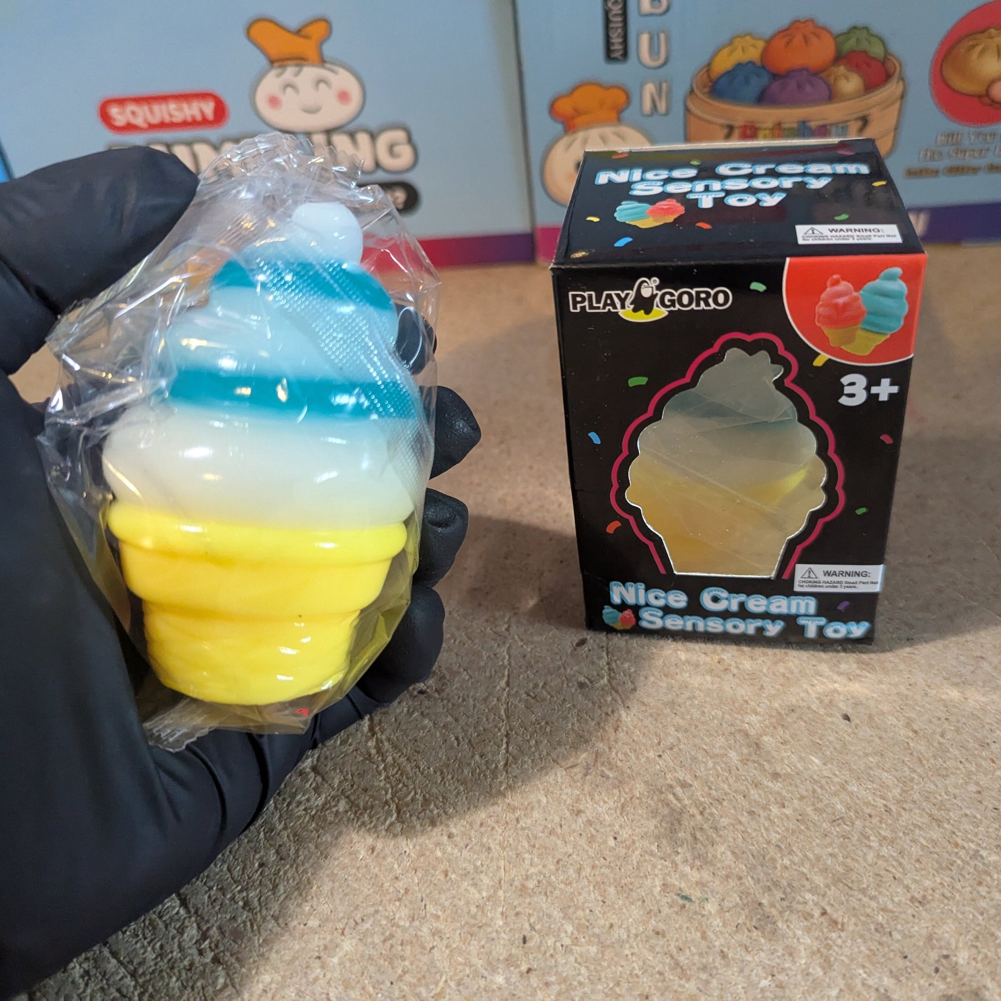 Blue and white swirl ice cream cone squishy from Ralphie's Funhouse, soft gelatin squish with realistic ice cream cone details.
