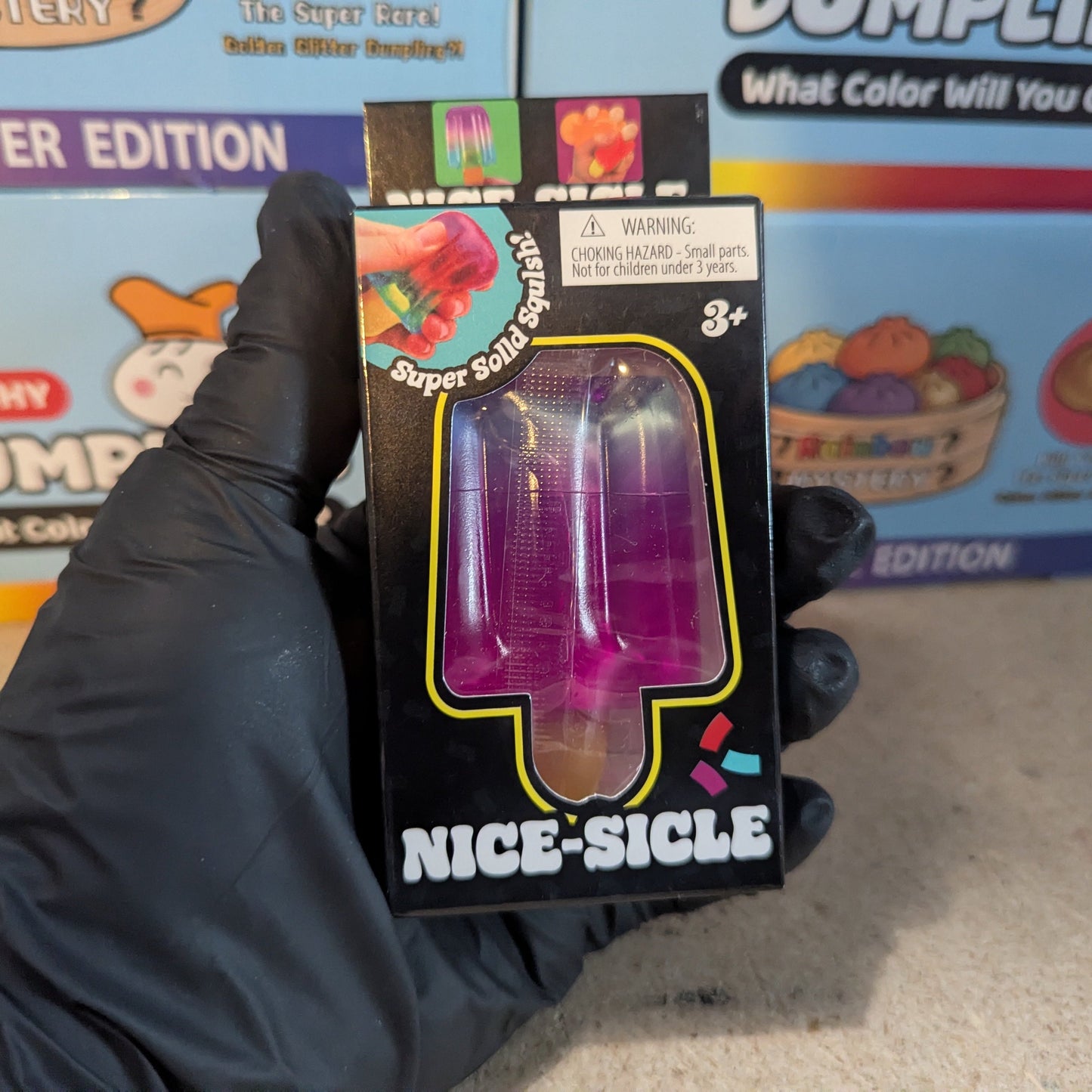 Blue to purple gelatin squish toy from Ralphie's Funhouse, soft and stretchy with a fun, squishy texture.