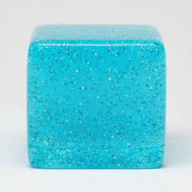 Blue translucent glitter mini magic cube by Squeeze Toys, slow-rising squish toy with a textured, glittery surface.