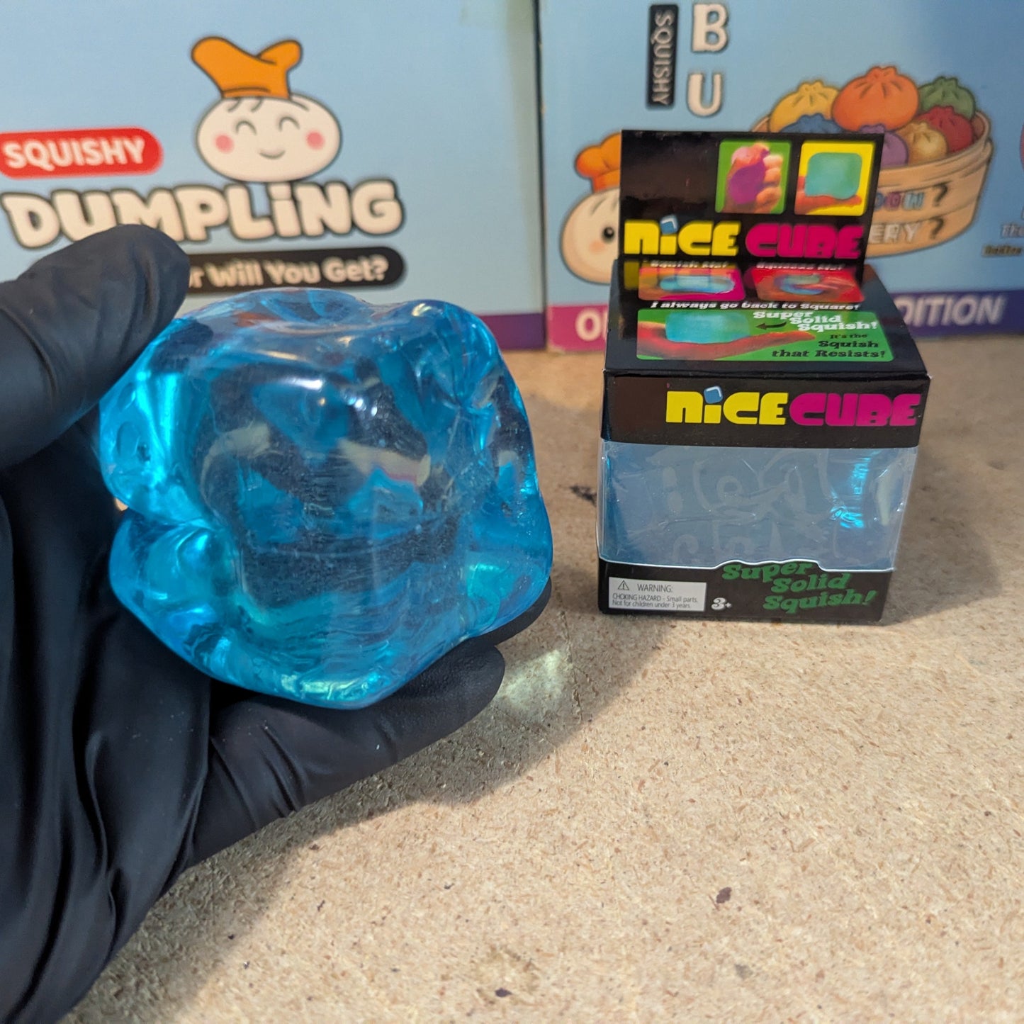 Blue Wannabe Nice Cube super slow-rising squish toy by Ralphie's Funhouse, soft and textured for stress relief.