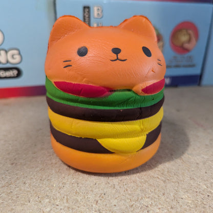 Cheeseburger cat squishy toy from Ralphie's Funhouse, made of slow foam with a realistic cheeseburger and cat design.