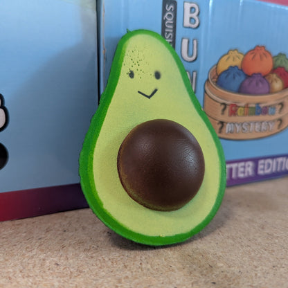 Half avocado squishy from Ralphie's Funhouse with soft foam texture, designed for stress relief and tactile fun.