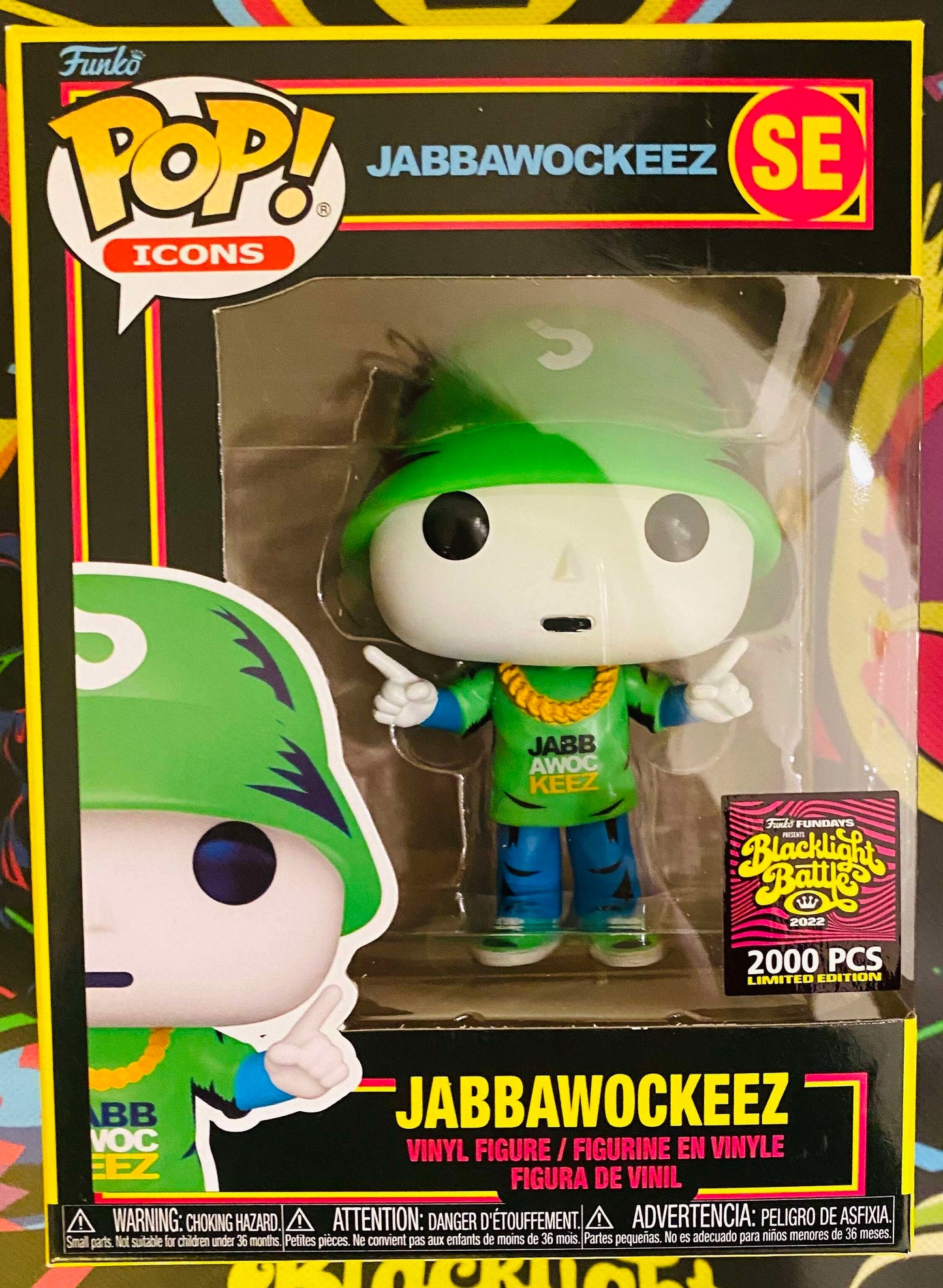 Ralphie's Funhouse Jabbawockeez mascot figure with white mask and costume, standing on a colorful background.