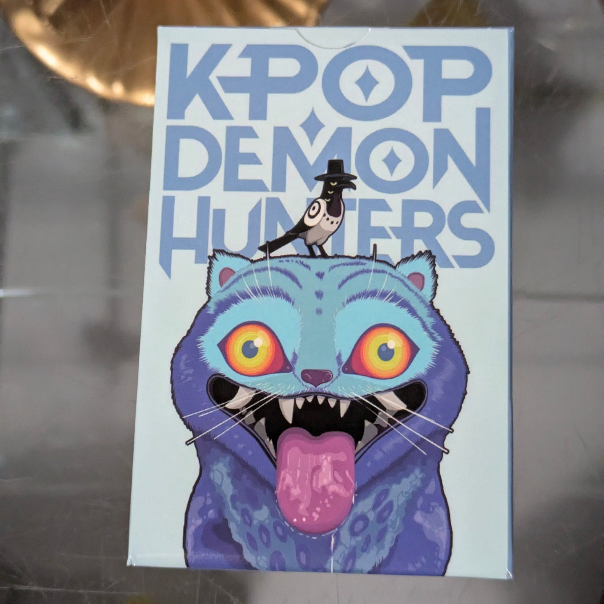 K-POP Demon Hunters collectible card set featuring Derpy Tiger edition with 55 cards, displayed in a neat fan arrangement.