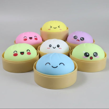 Pastel soft squishy bun mystery dumplings by Ralphie's Funhouse, featuring colorful, squishy plush dumpling toys.