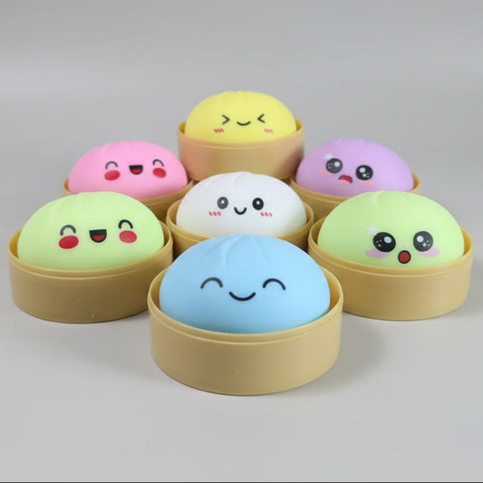 Pastel soft squishy bun mystery dumplings by Ralphie's Funhouse, featuring colorful, squishy plush dumpling toys.