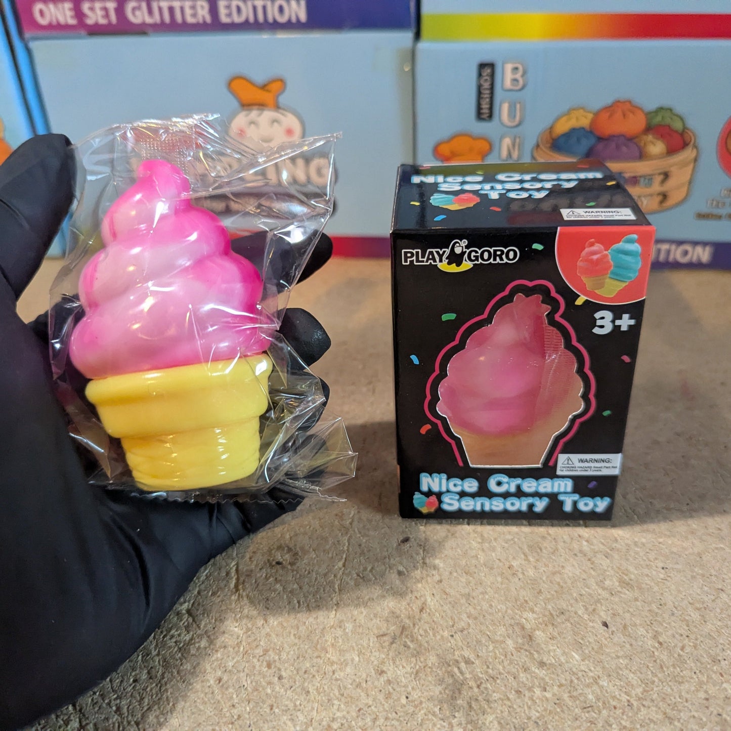 Pink creamy ice cream cone squishy from Ralphie's Funhouse, slow rising and soft, with detailed waffle cone and smooth ice cream topping.