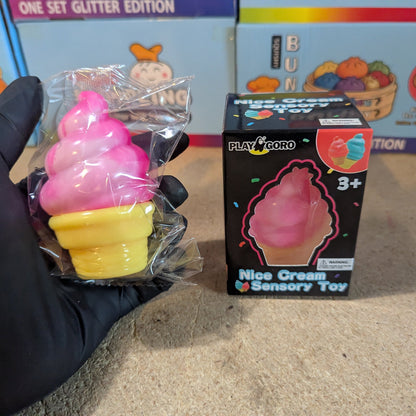 Pink creamy ice cream cone squishy from Ralphie's Funhouse, slow rising and soft, with detailed waffle cone and smooth ice cream topping.