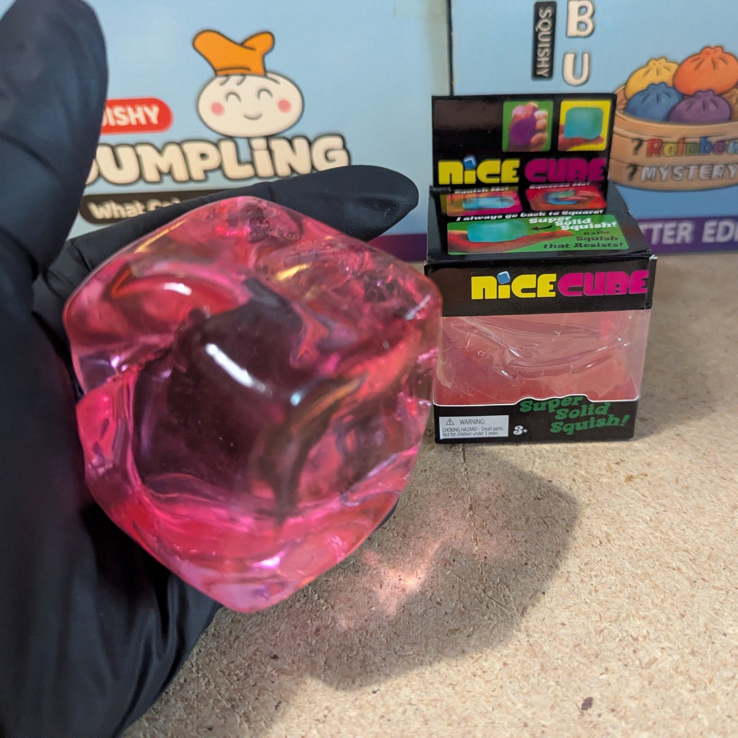Pink Wannabe Nice Cube from Ralphie's Funhouse, a super slow-rising squishy toy with a soft, textured surface.