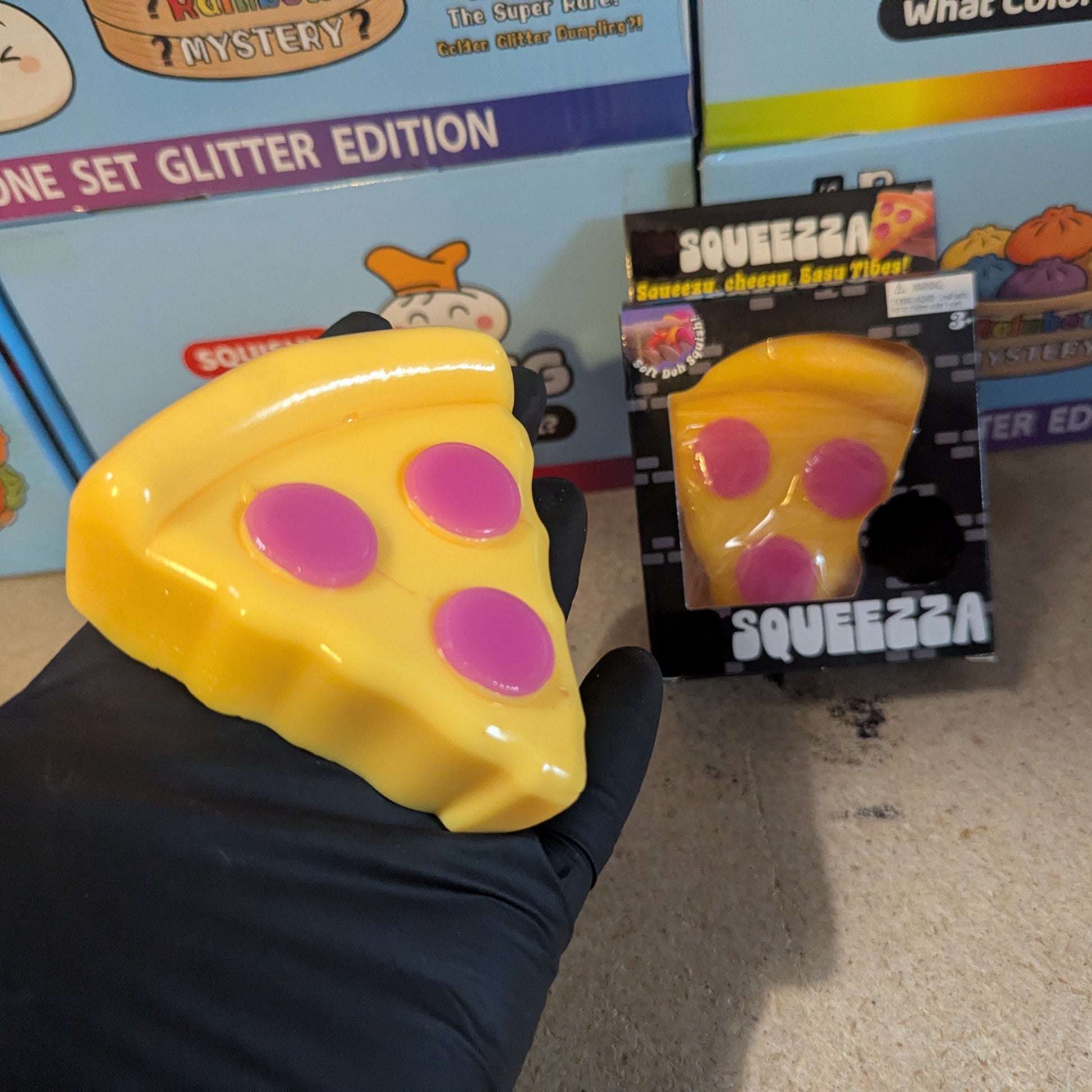 Ralphie's Funhouse Pizza Wannabe Squeezza Squish gelatin squish toy with colorful, stretchy, and soft texture in bright pizza shape.