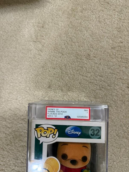 Flocked Winnie the Pooh Pop! Disney collectible figure, graded PSA 7.0, encased in a protective display holder.