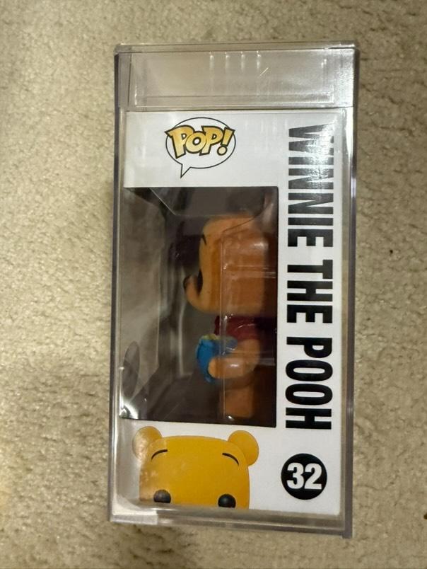 Flocked Winnie the Pooh Pop! Disney figure #32 from SDCC, graded PSA 7.0, encapsulated by Ralphie's Funhouse.