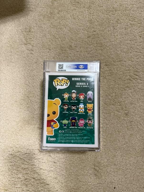 Flocked Winnie the Pooh Pop! Disney figure, #32 SDCC, graded PSA 7.0, encased in protective plastic, collectible toy from Ralphie's Funhouse