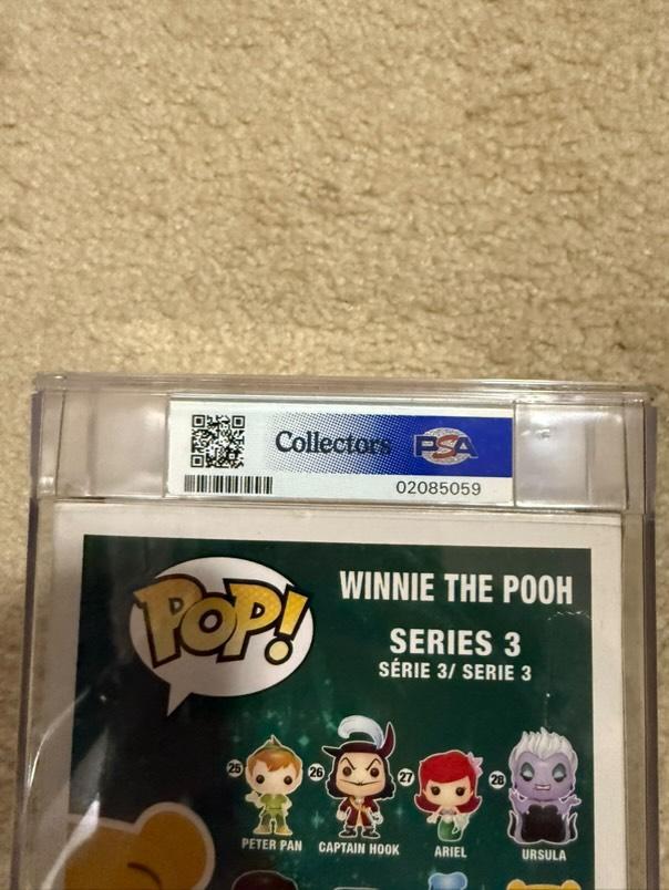 Flocked Winnie the Pooh Pop! Disney figure, SDCC Limited Edition #32, graded PSA 7.0, encased in protective capsule.