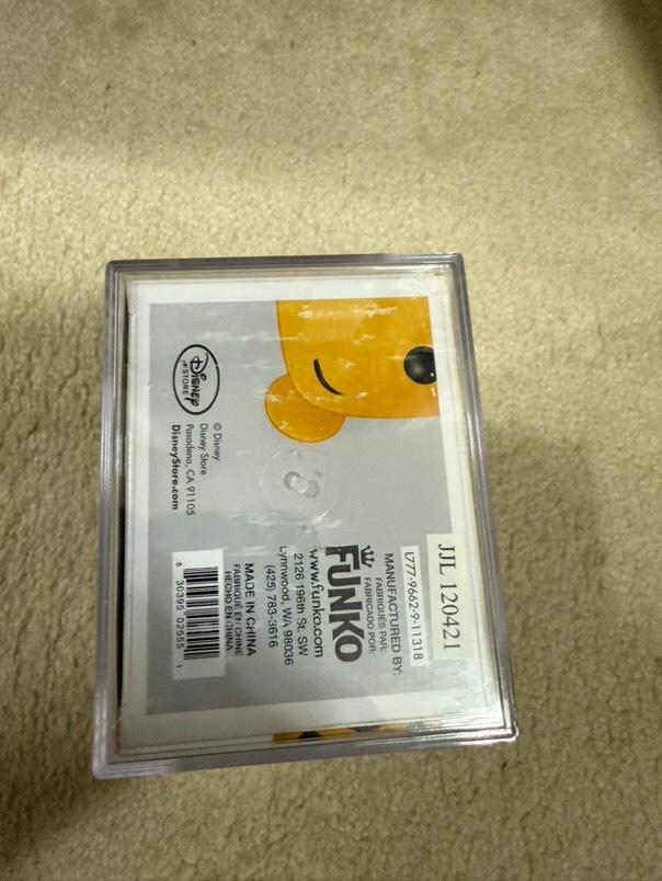Flocked Winnie the Pooh Pop! Disney figure (#32) from SDCC, graded PSA 7.0, encapsulated, featuring classic Disney character.