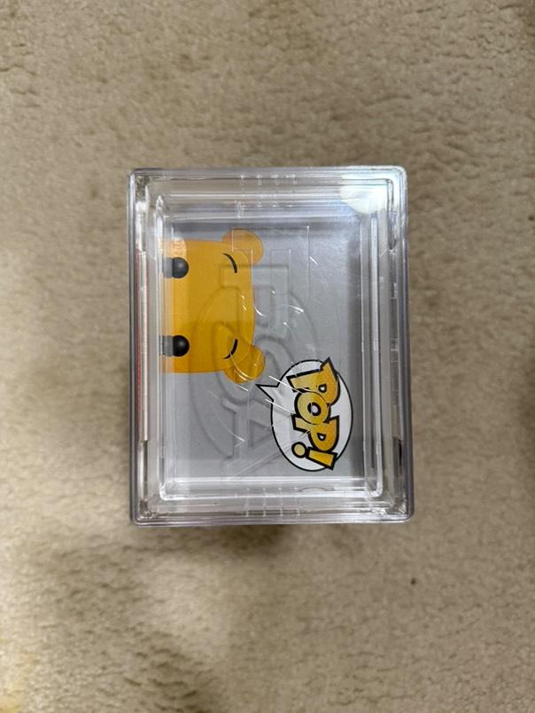 Flocked Winnie the Pooh Pop! Disney figure, SDCC exclusive #32, graded PSA 7.0, in display capsule, collectible toy from Ralphie's Funhouse