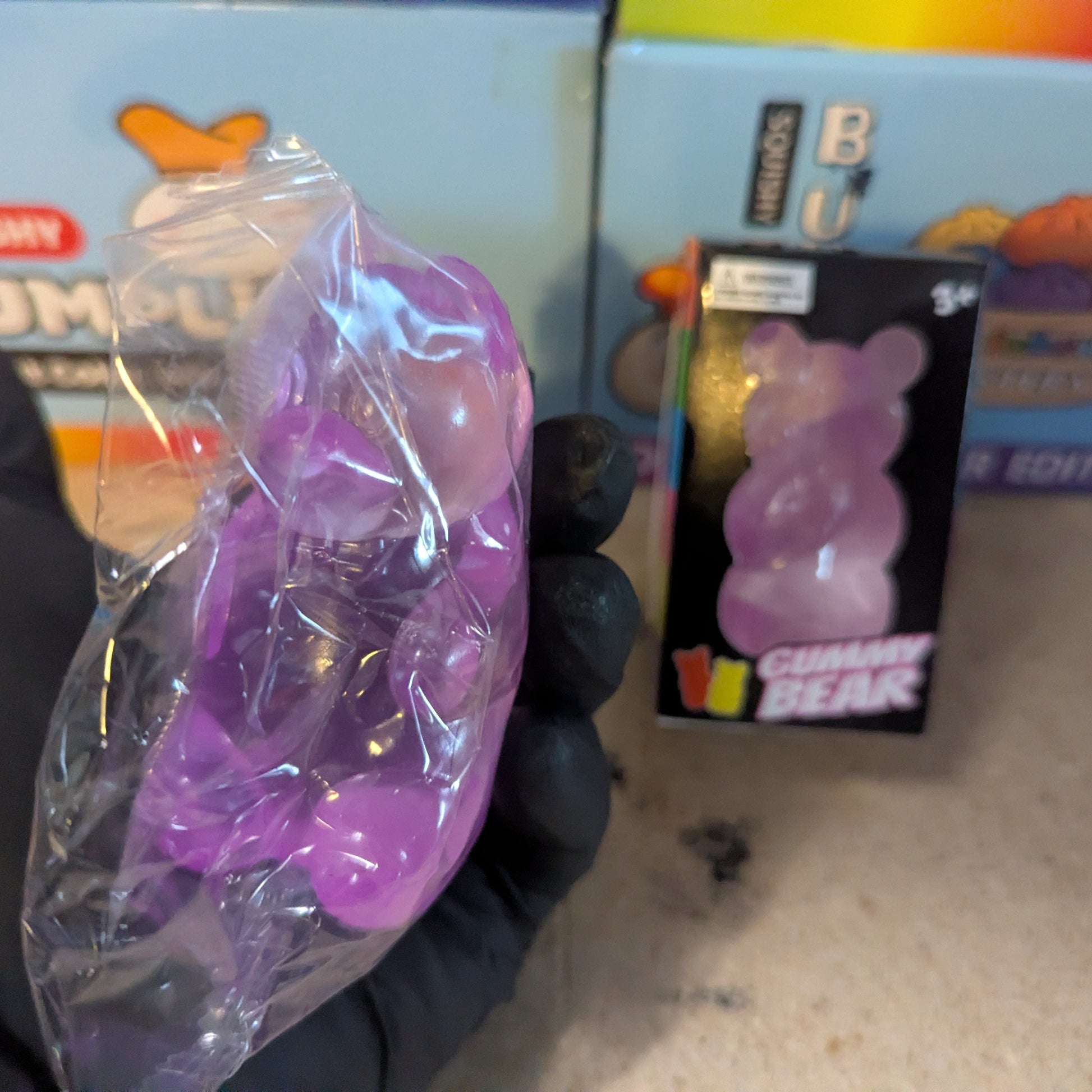 Purple Gummy Bear Squish toy from Ralphie's Funhouse, slow-rising squishy with a soft, textured gummy bear design.