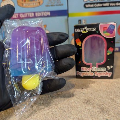 Purple to blue gelatin ice cream popsicle squish toy from Ralphie's Funhouse, soft and squeezable with colorful design.
