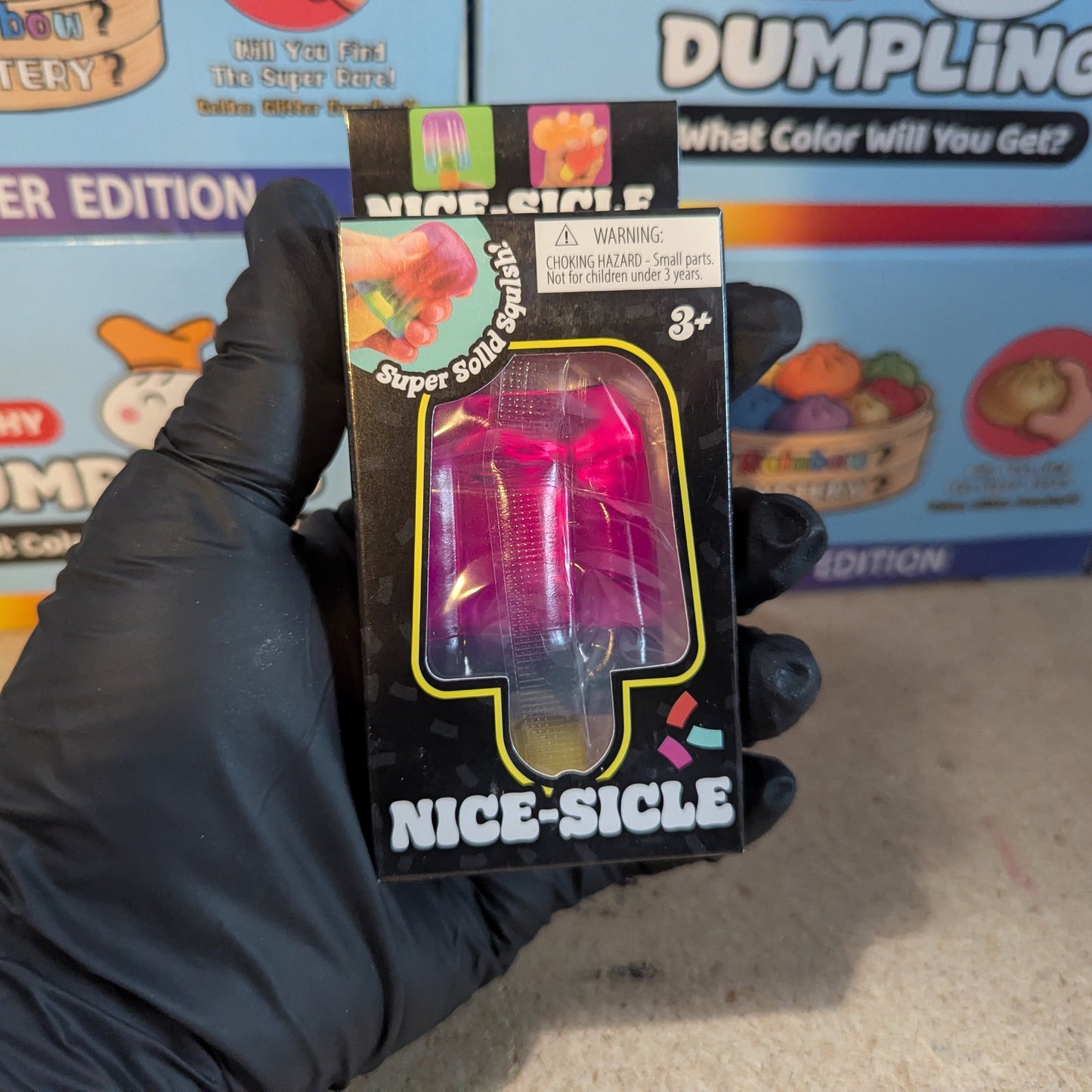 Purple to blue gelatin squish toy from Ralphie's Funhouse, soft and squishy sensory stress-relief toy.