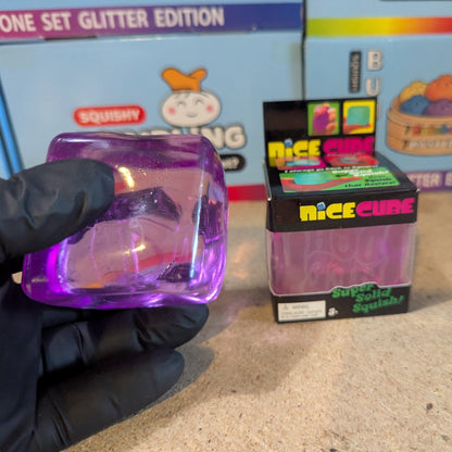 Purple Wannabe Nice Cube super slow-rising squish toy by Ralphie's Funhouse, soft and textured for sensory fun.