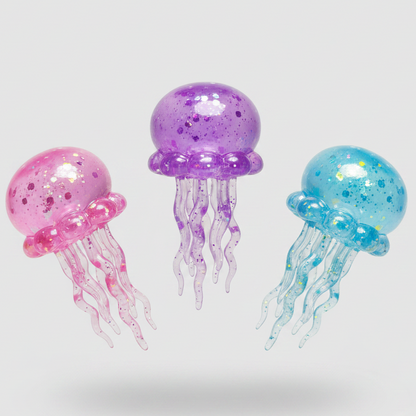 Set of three slow-rising jellyfish squish toys with tentacles from Ralphie's Funhouse, colorful and soft for sensory play.
