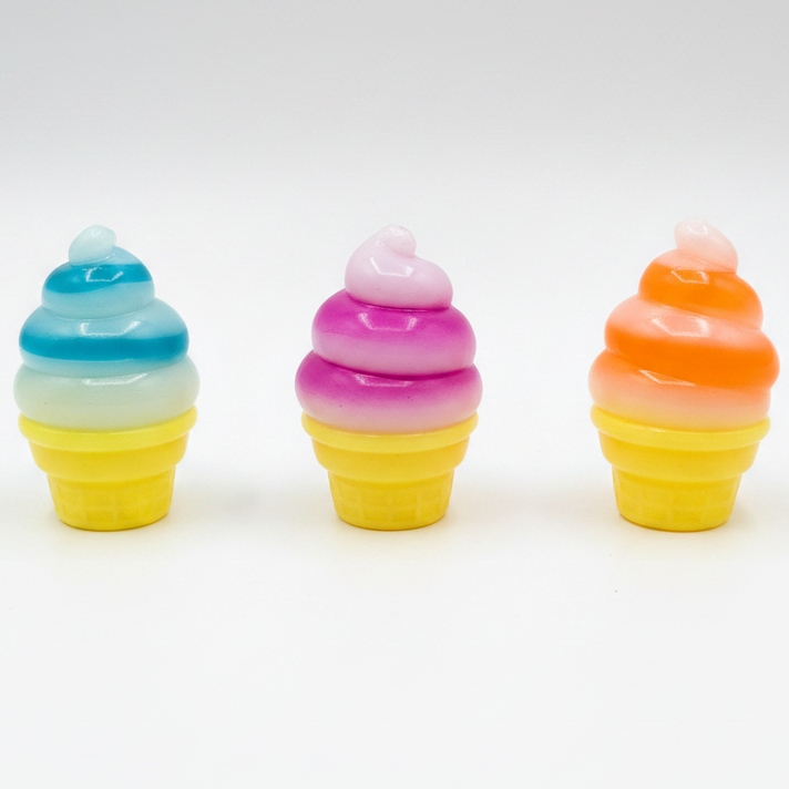 Set of three swirl ice cream cone squishies by Ralphie's Funhouse, soft gelatin squish toys in colorful cone shapes.