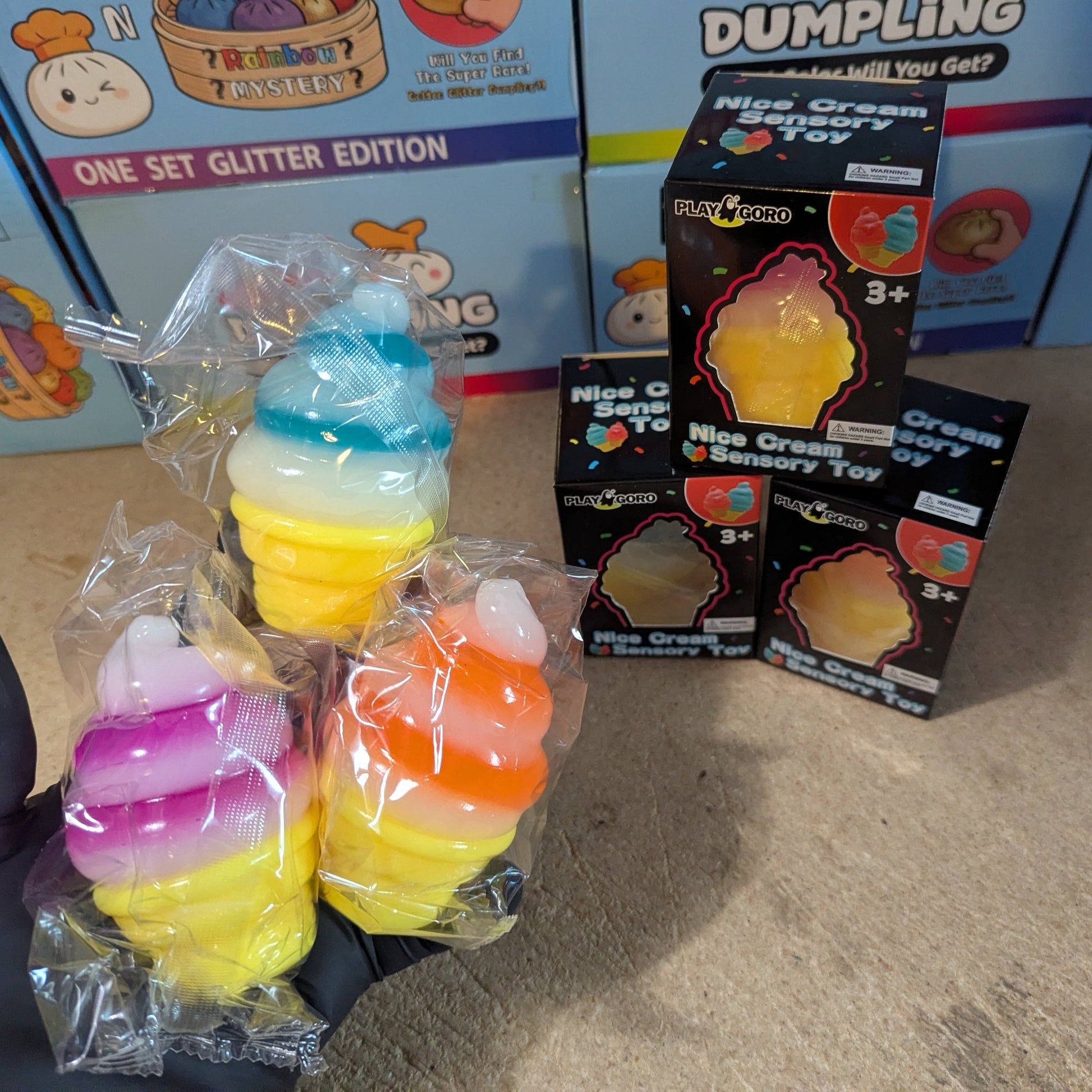 Set of three swirl ice cream cone squishies by Ralphie's Funhouse, soft gelatin stress toys with colorful swirl designs.