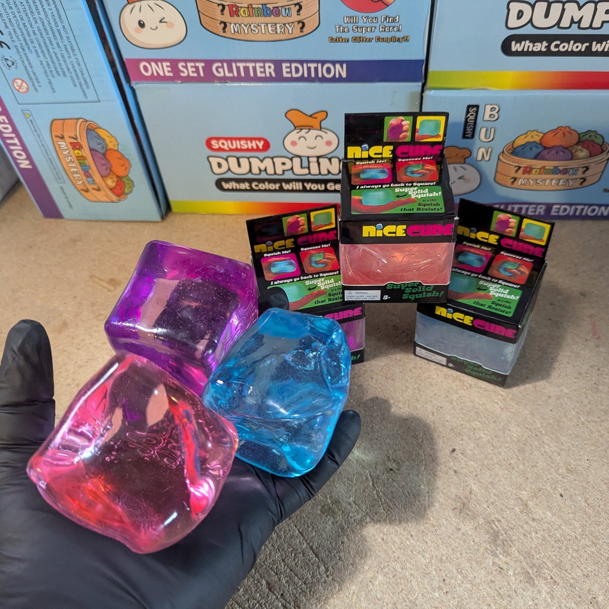 Set of three Ralphie's Funhouse Wannabe Nice Cubes, super slow-rising squish toys with colorful, textured surfaces.