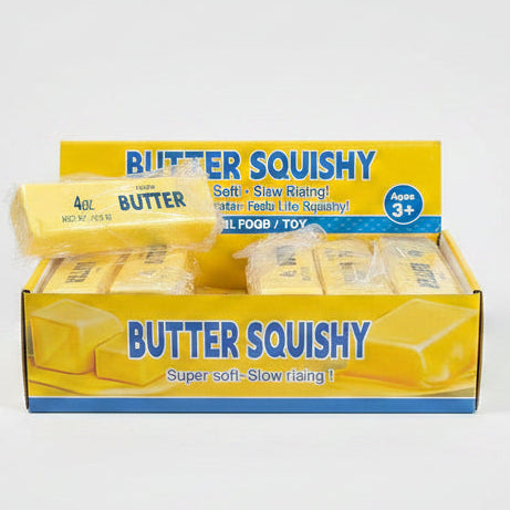 Small butter-shaped squishy toy from Ralphie's Funhouse, scented like fresh butter, with realistic yellow butter color.