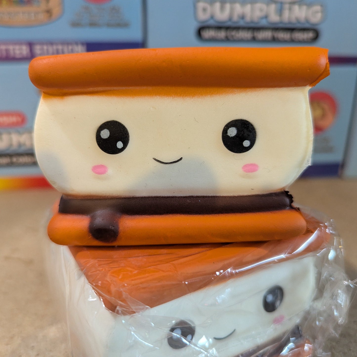 Ralphie's Funhouse Smilin' S'more squishy stress relief toy with slow foam squish and smiling face design.