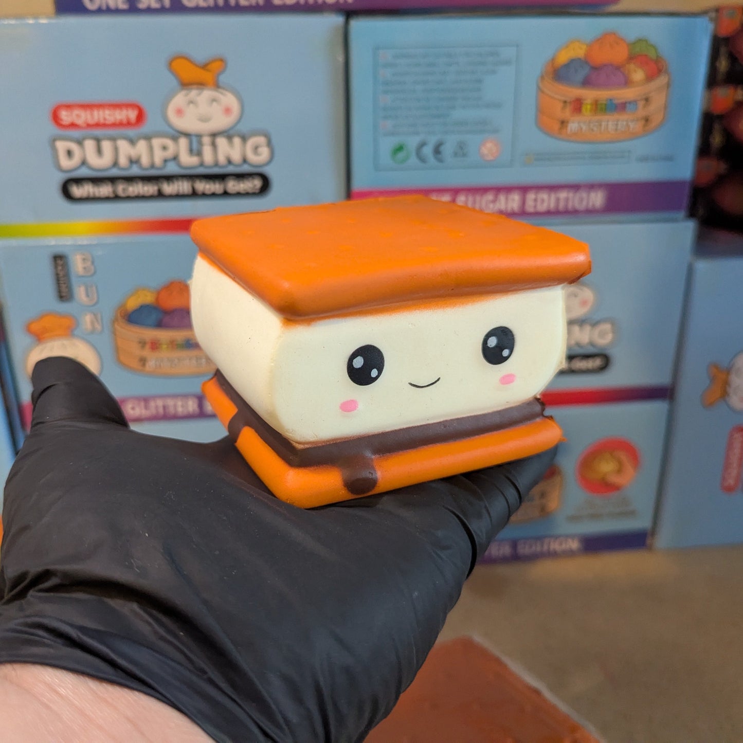 Ralphie's Funhouse Smilin' S'more squishy toy with a smiling face, featuring foam and marshmallow details for slow squish fun.