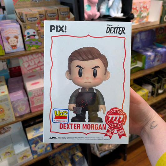 Dexter Morgan PIX vinyl figure from Ralphie's Funhouse, featuring detailed design and collectible packaging.