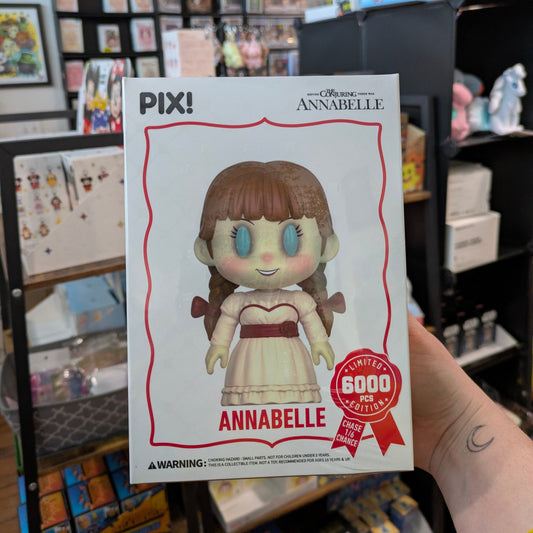 Ralphie's Funhouse Annabelle PIX vinyl figure from The Conjuring, featuring detailed design and collectible packaging.