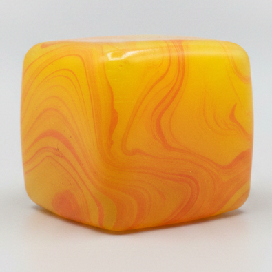 Yellow and orange swirl squeeze cube from Ralphie's Funhouse, a super slow-rising squish toy for stress relief and sensory play.