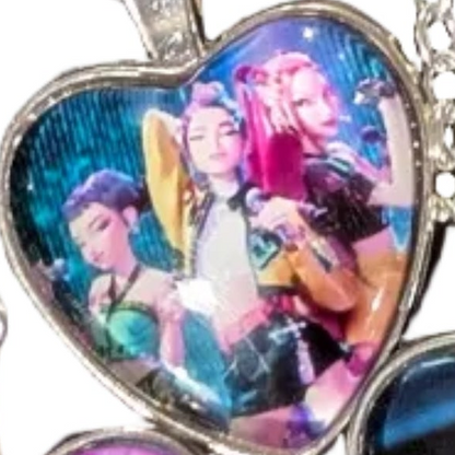 K-POP DEMON HUNTERS Heart Pendant Necklace featuring character art from Ralphie's Funhouse, with Jinu and Rumi designs.