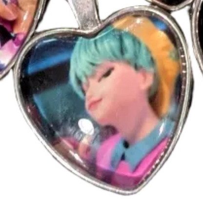 K-POP Demon Hunters heart pendant necklace featuring character art of Jinu and Rumi from Ralphie's Funhouse collection.