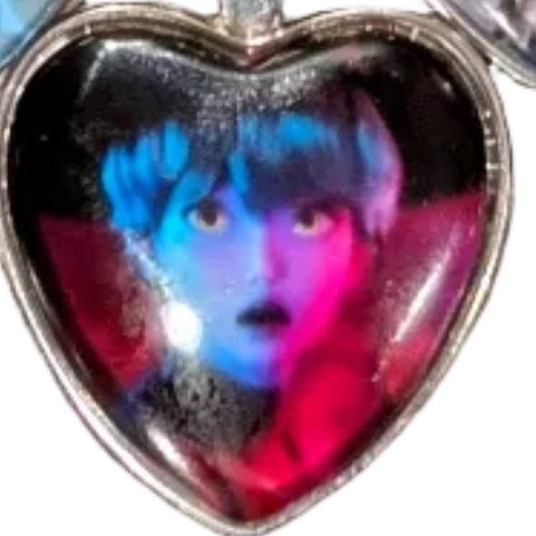 K-POP Demon Hunters Heart Pendant Necklace featuring character art of Jinu and Rumi from Ralphie's Funhouse collection.